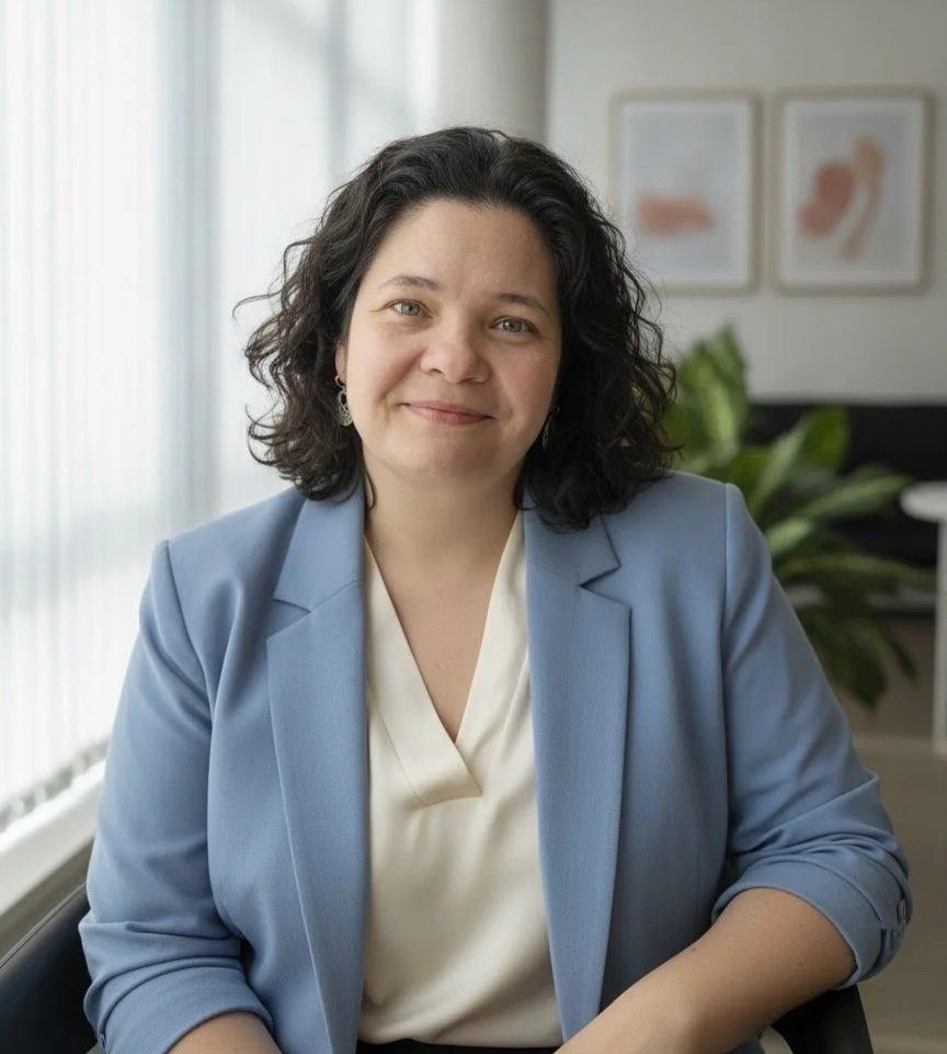 Jennifer Coonce, LP, smiling in her Brooklyn office